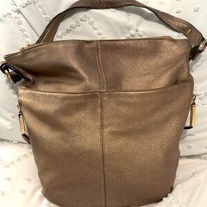 B Makowsky gold metallic bag. Side , front pocket.